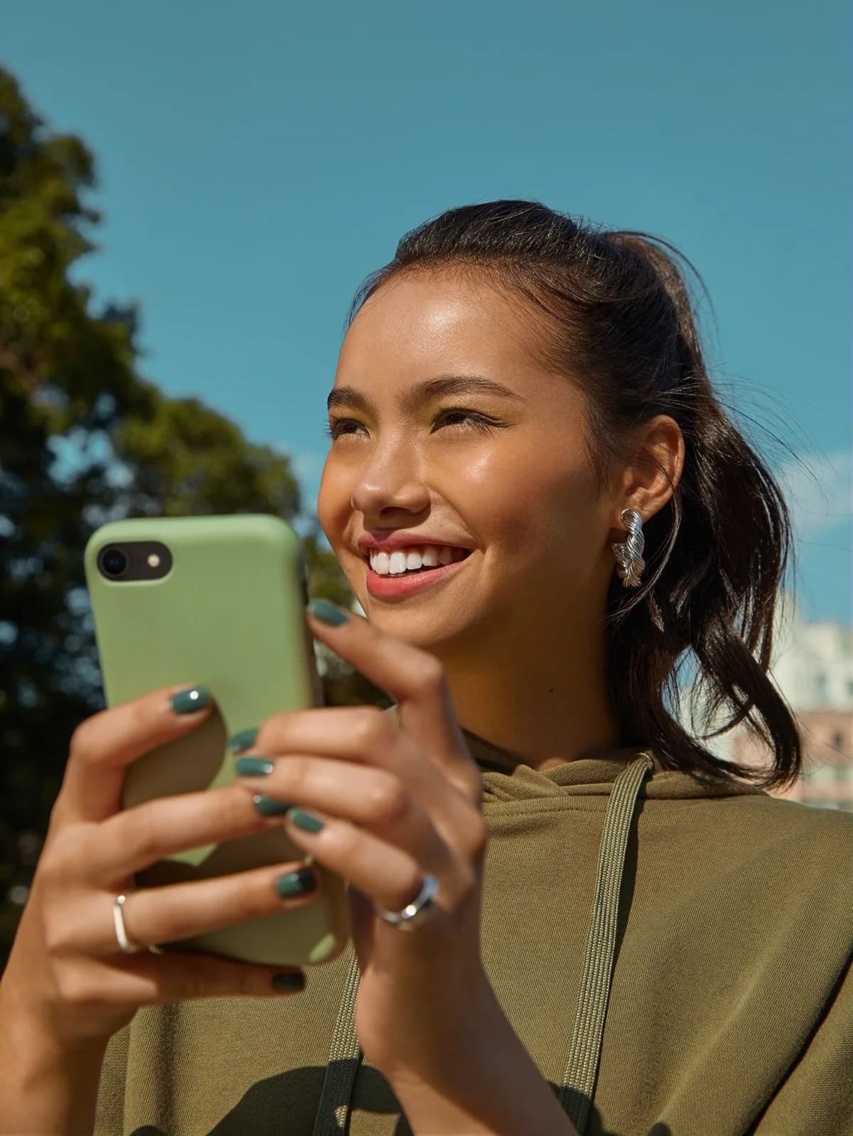 A customer reading their phone outdoors.